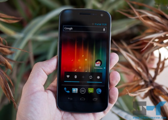 Samsung Galaxy Nexus in hand - on homescreen Samsung Galaxy Nexus in hand - on homescreen