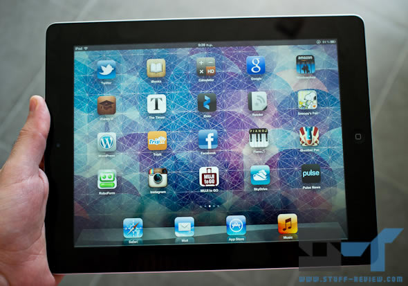 3rd generation iPad in hand - homescreen 3rd generation iPad in hand - homescreen